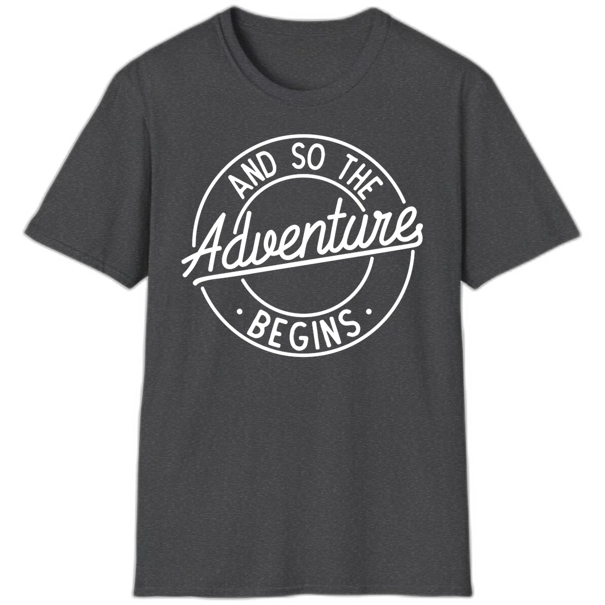 Vintage circular badge design with white text reading 'And So The Adventure Begins' on gray background in Dark Heather