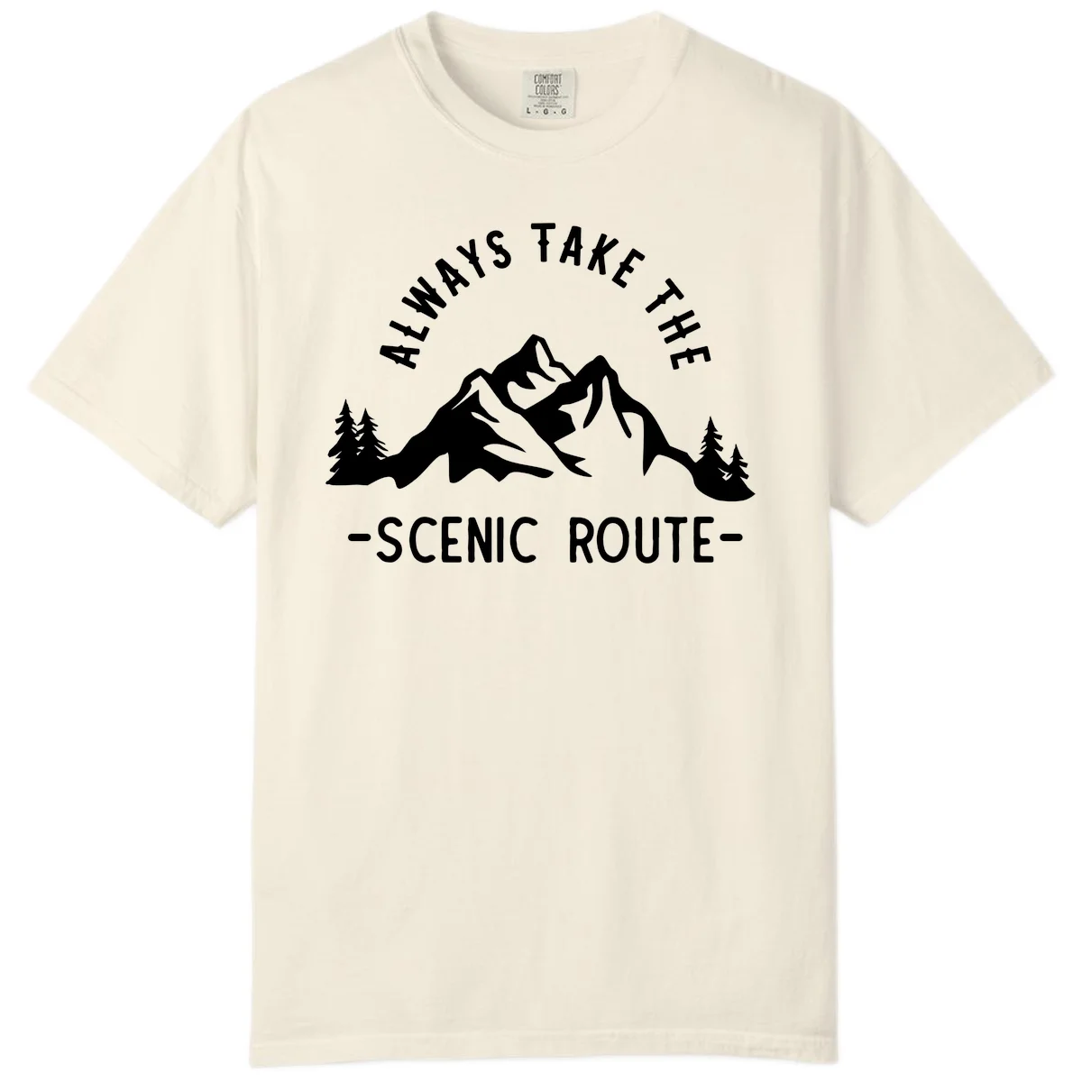 Mountain landscape with evergreen trees and text reading 'Always Take The Scenic Route' in bold lettering in Ivory