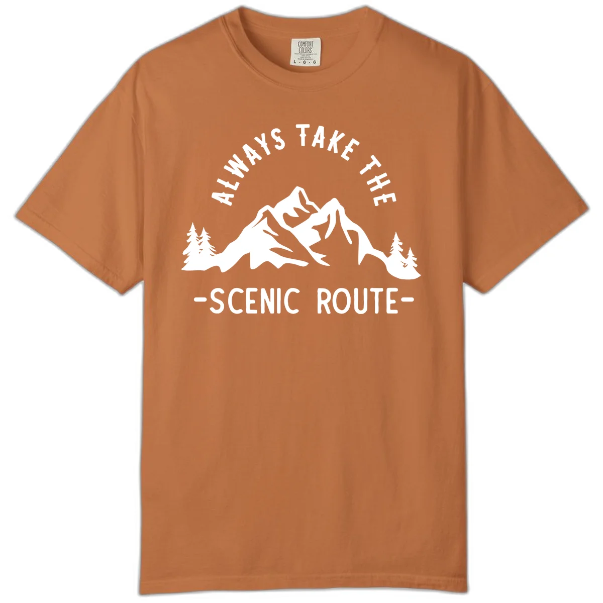 Mountain landscape with evergreen trees and text reading 'Always Take The Scenic Route' in bold lettering in Yam