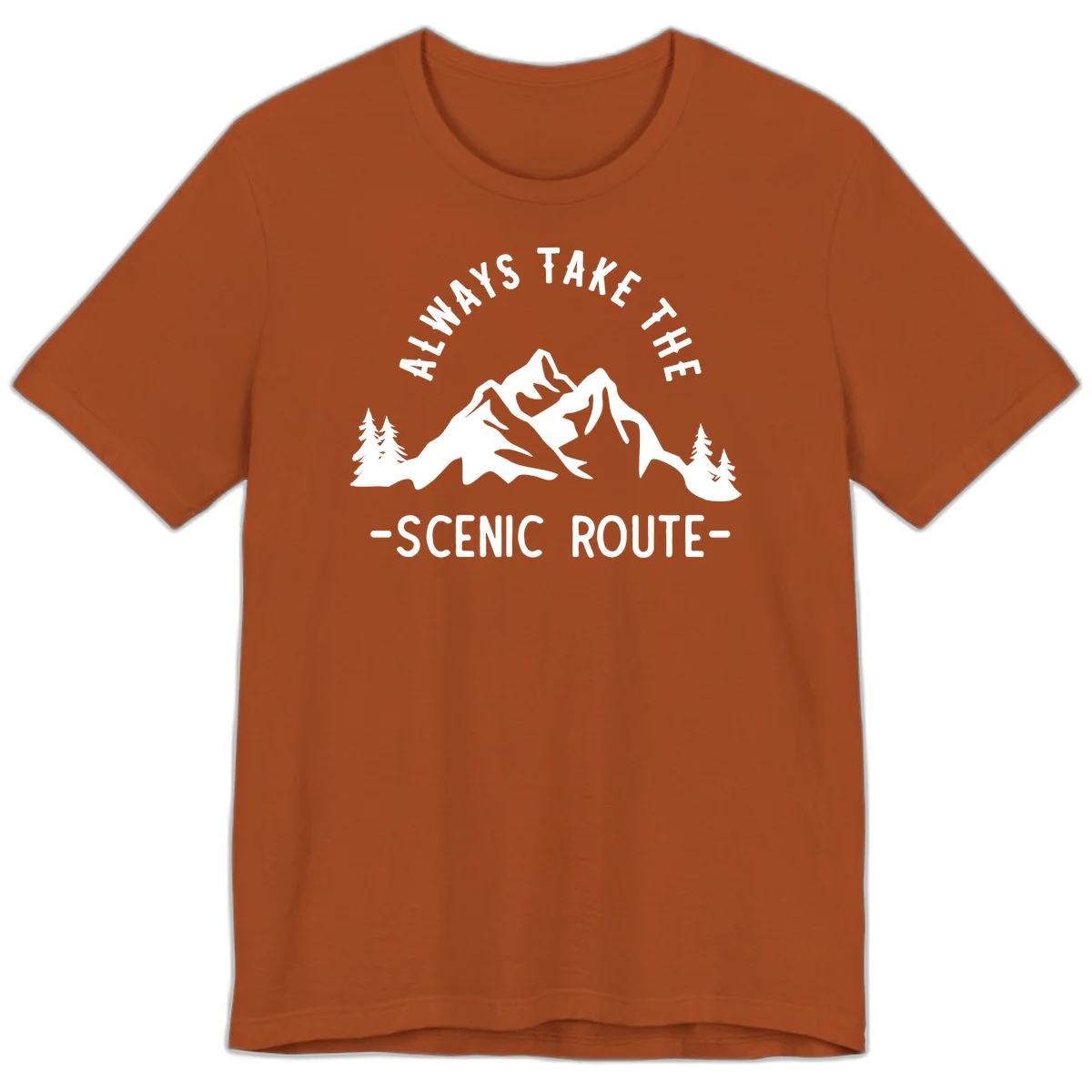 Mountain landscape with evergreen trees and text reading 'Always Take The Scenic Route' in bold lettering in Autumn