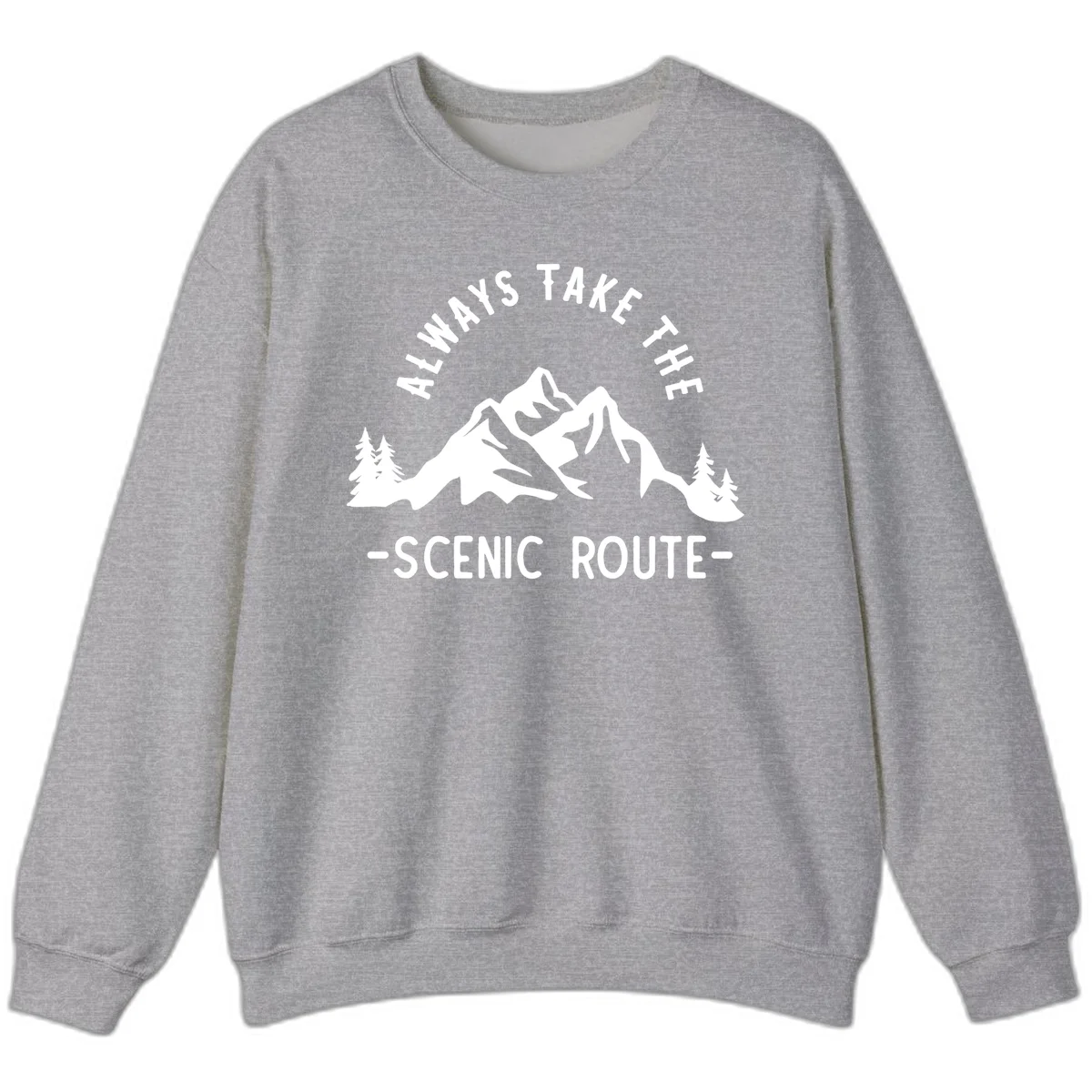 Mountain landscape with evergreen trees and text reading 'Always Take The Scenic Route' in bold lettering in Sport Grey