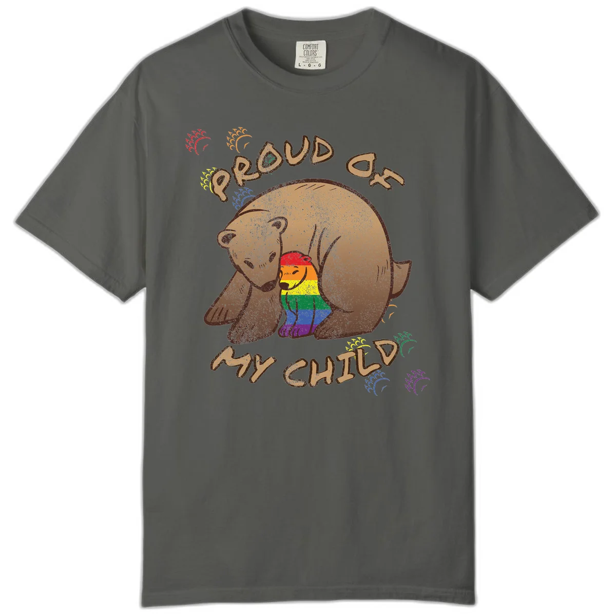 Brown bear proudly displaying rainbow pride colors with 'Proud As Shit' text and decorative bursts in Pepper