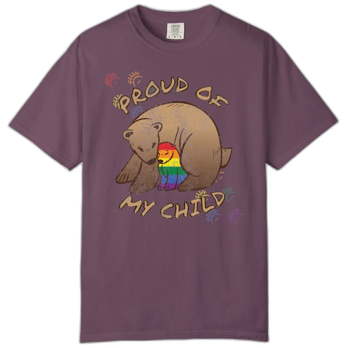 Brown bear proudly displaying rainbow pride colors with 'Proud As Shit' text and decorative bursts in Berry