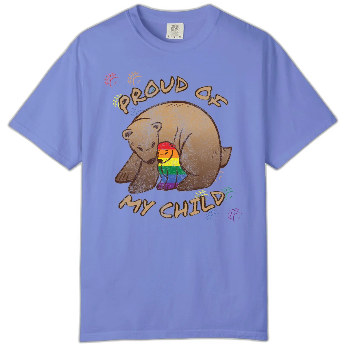 Brown bear proudly displaying rainbow pride colors with 'Proud As Shit' text and decorative bursts in Flo Blue