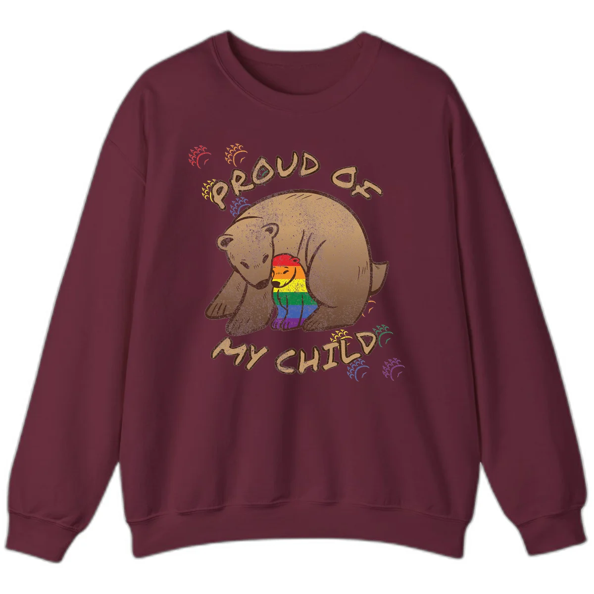 Brown bear proudly displaying rainbow pride colors with 'Proud As Shit' text and decorative bursts in Maroon