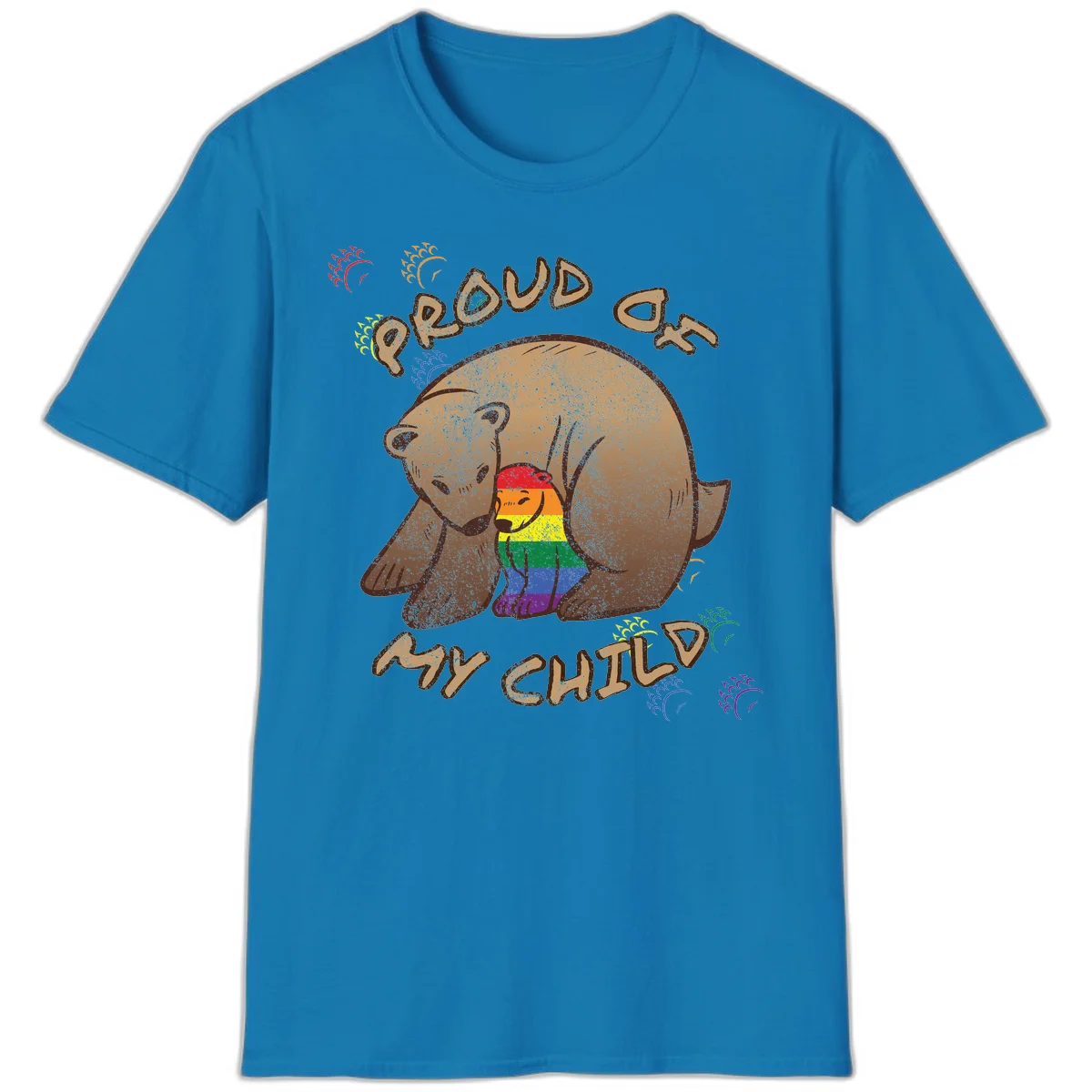Brown bear proudly displaying rainbow pride colors with 'Proud As Shit' text and decorative bursts in Sapphire