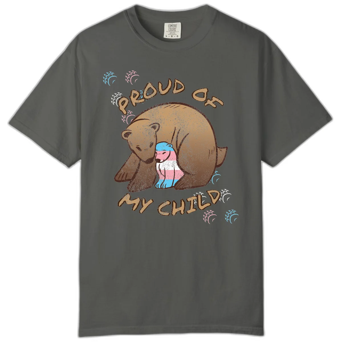 Brown bear holding a cub with blue, pink and white stripes, surrounded by 'Proud As My Chubby' text and decorative wave designs celebrating transgender pride in Pepper