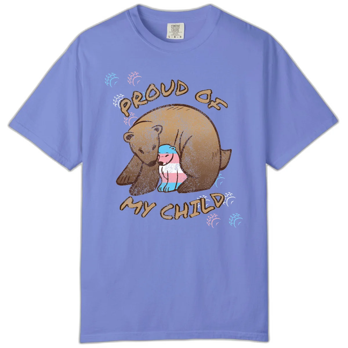 Brown bear holding a cub with blue, pink and white stripes, surrounded by 'Proud As My Chubby' text and decorative wave designs celebrating transgender pride in Flo Blue