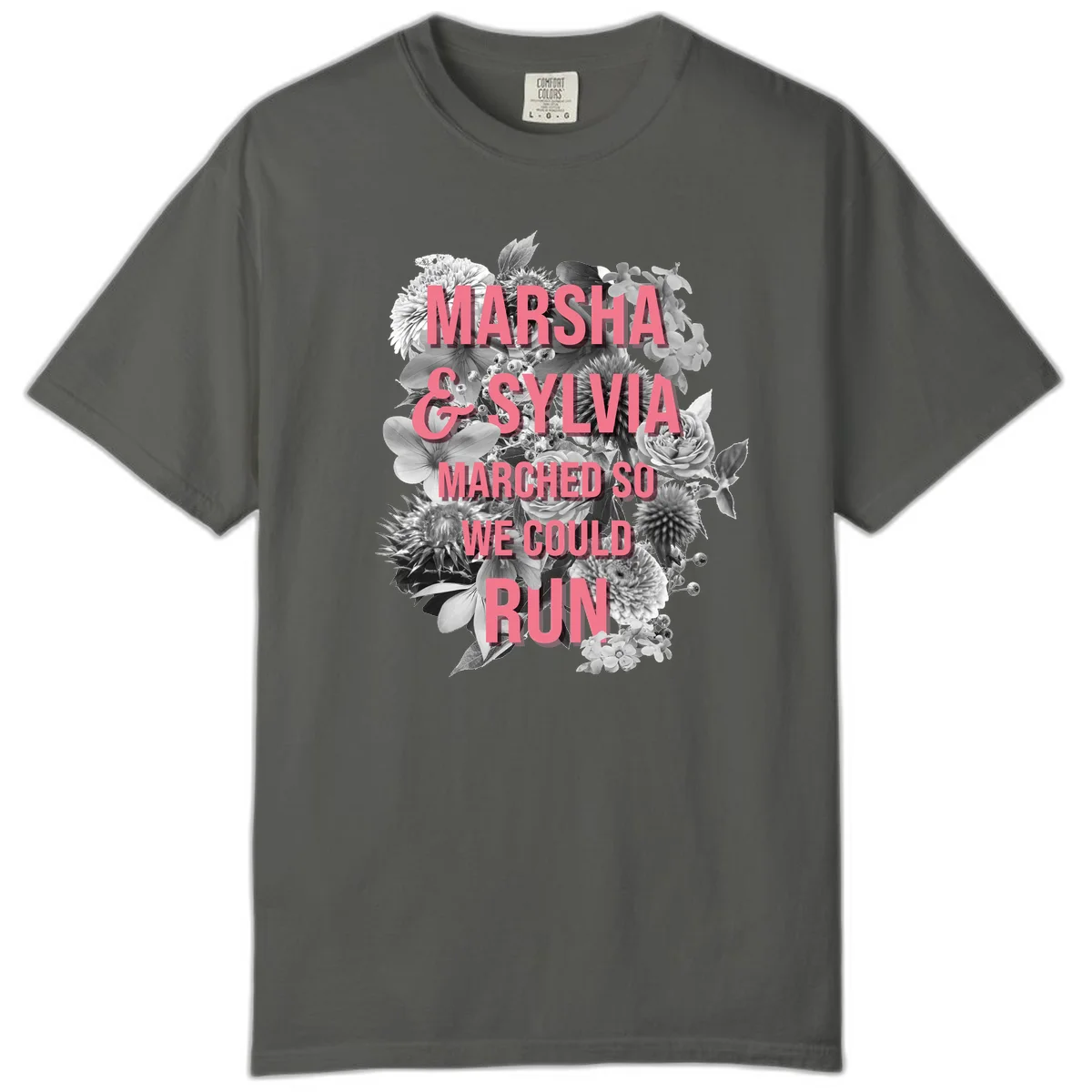 Pink text reading 'Marsha & Sylvia Marched So We Could Run' overlaid on black and white floral arrangement with roses and dahlias in Pepper