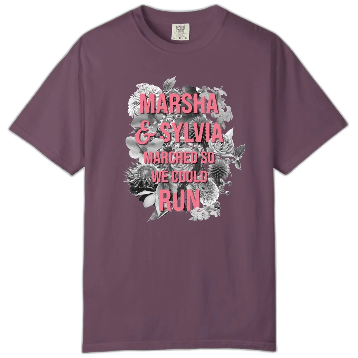 Pink text reading 'Marsha & Sylvia Marched So We Could Run' overlaid on black and white floral arrangement with roses and dahlias in Berry