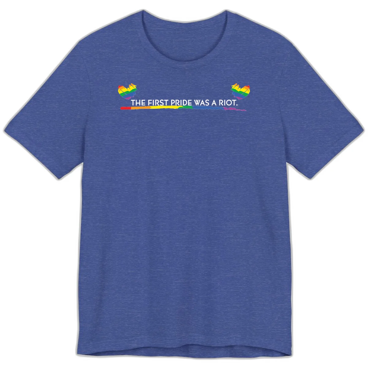 Gray background with white text reading 'THE FIRST PRIDE WAS A RIOT' surrounded by rainbow pride hearts and gradient stripe in Heather True Royal