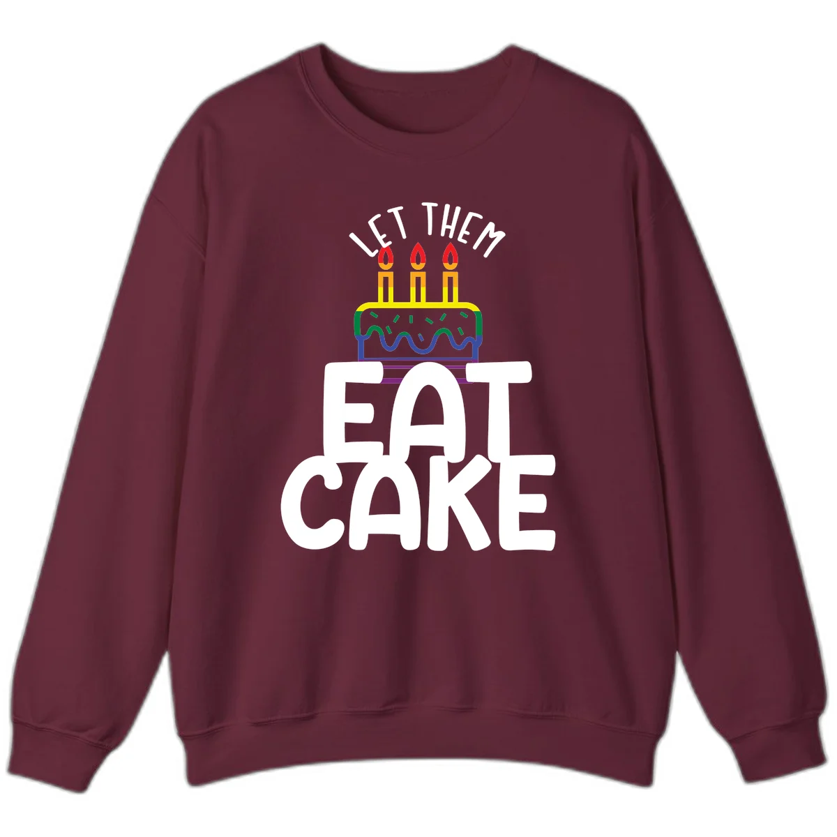 Rainbow-layered birthday cake with three candles above bold white text reading 'Let Them Eat Cake' - a Pride-themed design in Maroon