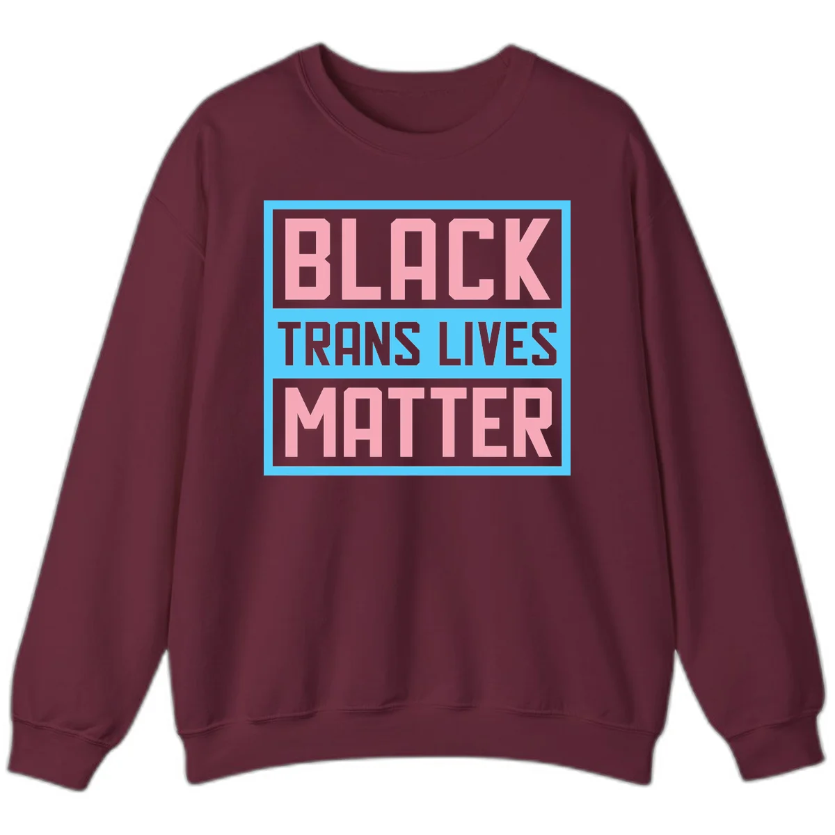 Bold pink block letters spelling 'BLACK TRANS LIVES MATTER' on light blue and gray background in Maroon