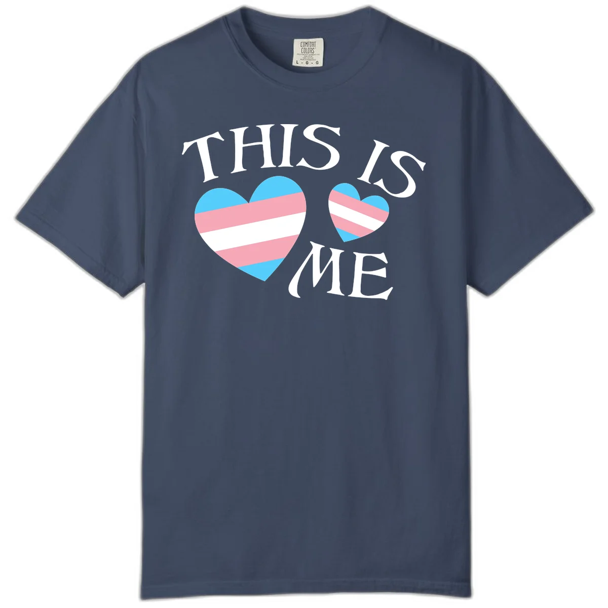 Two striped hearts in trans flag colors (blue, pink, white) with 'THIS IS ME' text celebrating trans pride and identity in Midnight