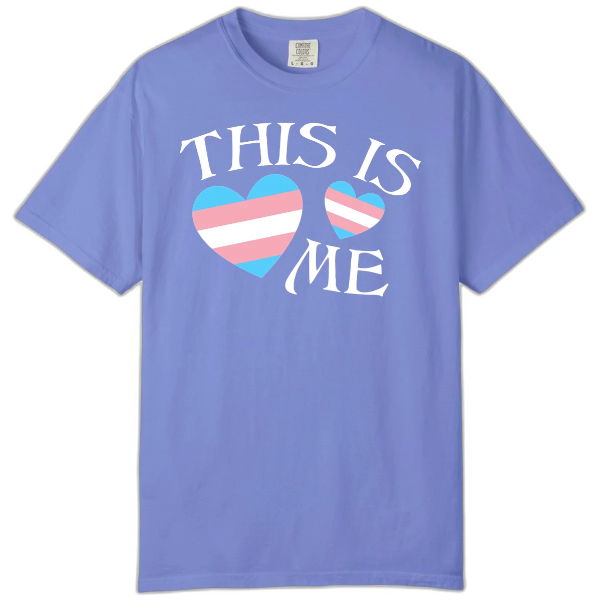 Two striped hearts in trans flag colors (blue, pink, white) with 'THIS IS ME' text celebrating trans pride and identity in Flo Blue