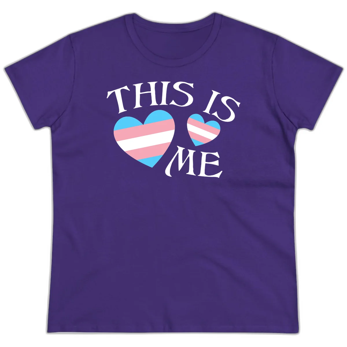 Two striped hearts in trans flag colors (blue, pink, white) with 'THIS IS ME' text celebrating trans pride and identity in Purple