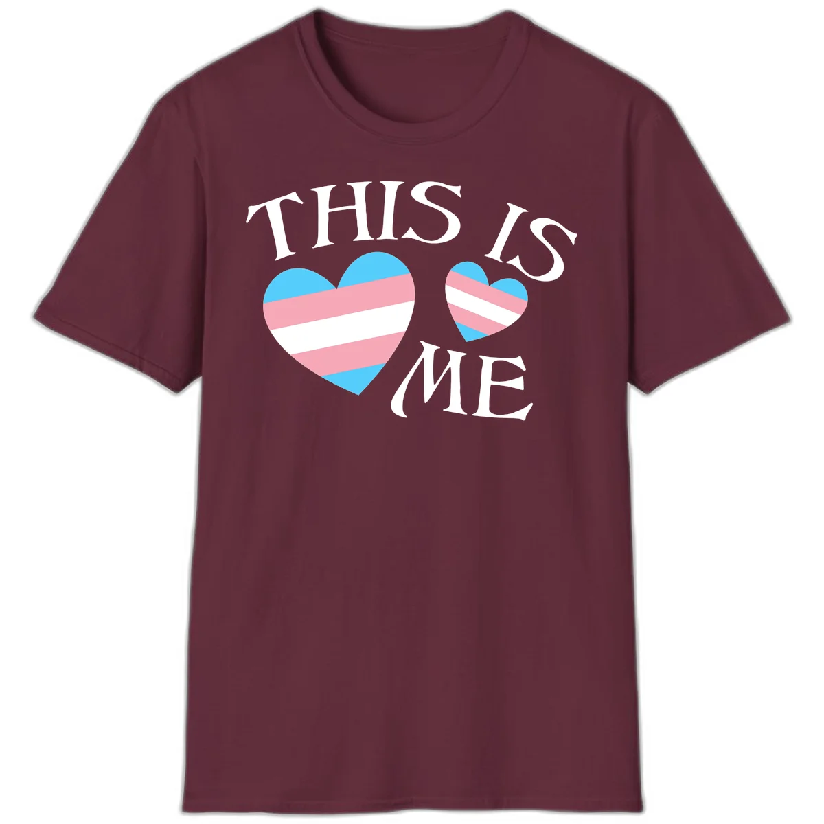 Two striped hearts in trans flag colors (blue, pink, white) with 'THIS IS ME' text celebrating trans pride and identity in Maroon