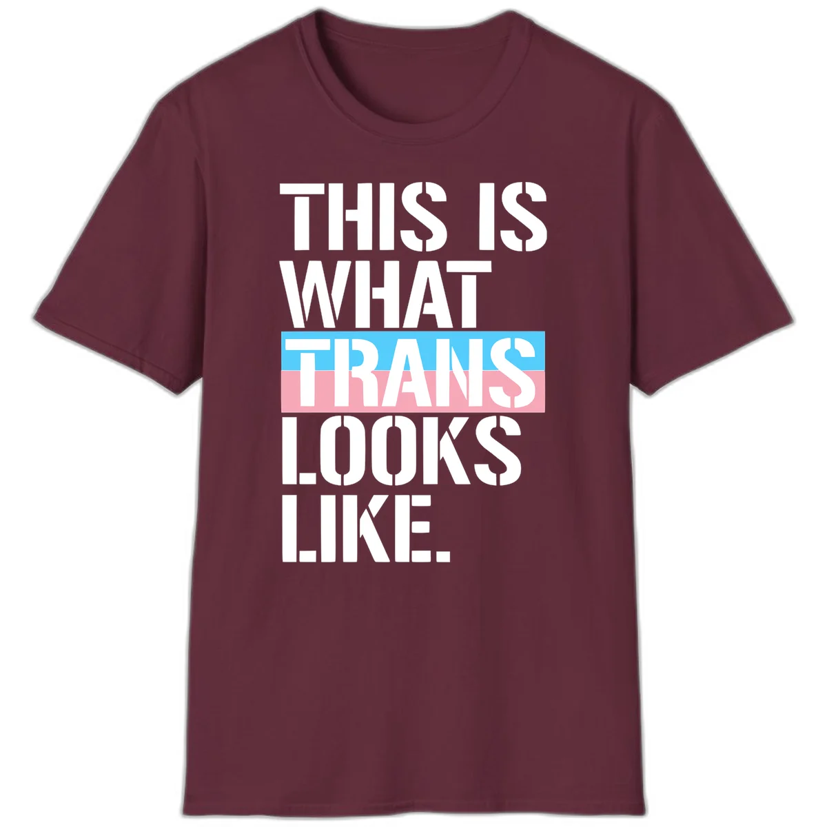 Bold typography design reading 'THIS IS WHAT TRANS LOOKS LIKE' with trans pride flag colors in blue and pink stripe in Maroon