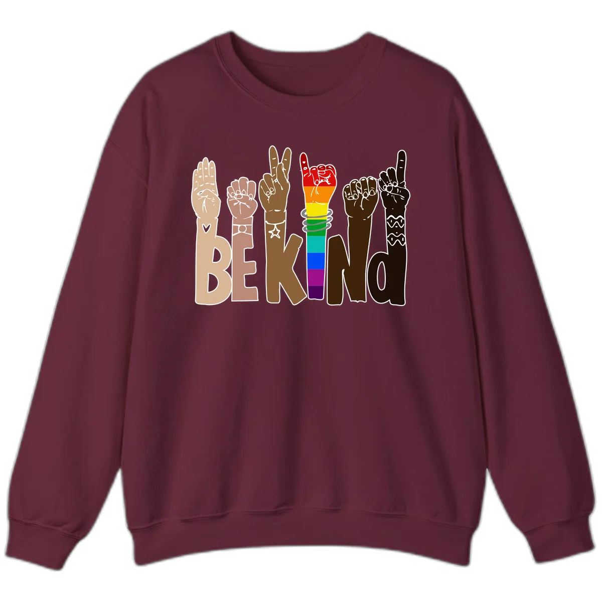 Six illustrated hands in diverse skin tones displaying peace signs and fists, with center fist in rainbow pride colors and 'BE KIND' text below in Maroon