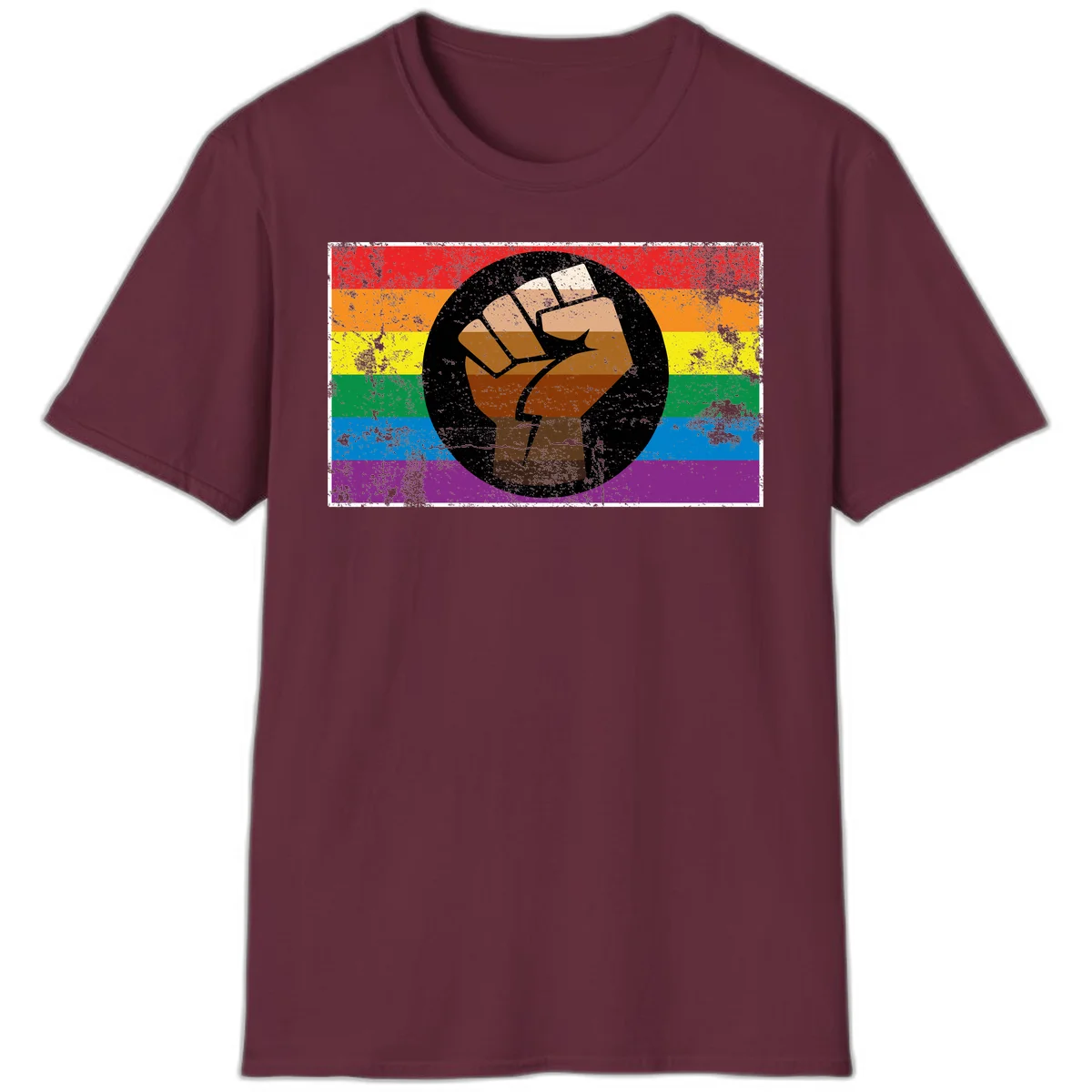 Distressed circular badge featuring a raised brown fist overlaid on a rainbow pride flag background, symbolizing LGBTQ+ solidarity and empowerment in Maroon