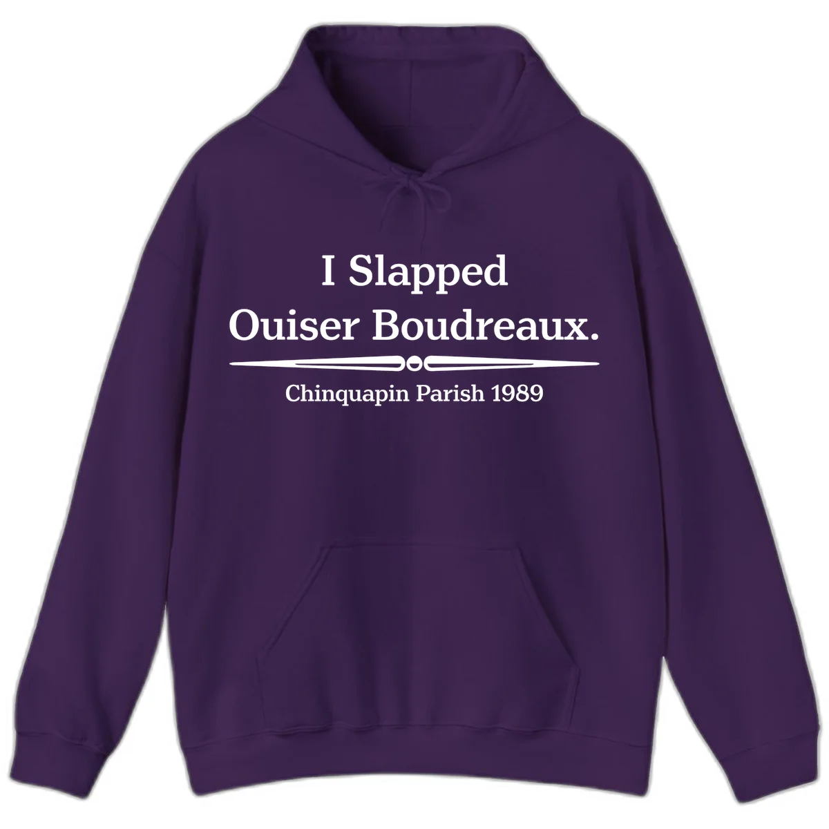 White text on gray background reading 'I Slapped Ouiser Boudreaux. Chinquapin Parish 1989' with decorative line divider in Purple