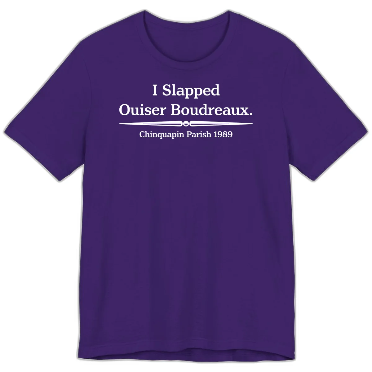 White text on gray background reading 'I Slapped Ouiser Boudreaux. Chinquapin Parish 1989' with decorative line divider in Team Purple