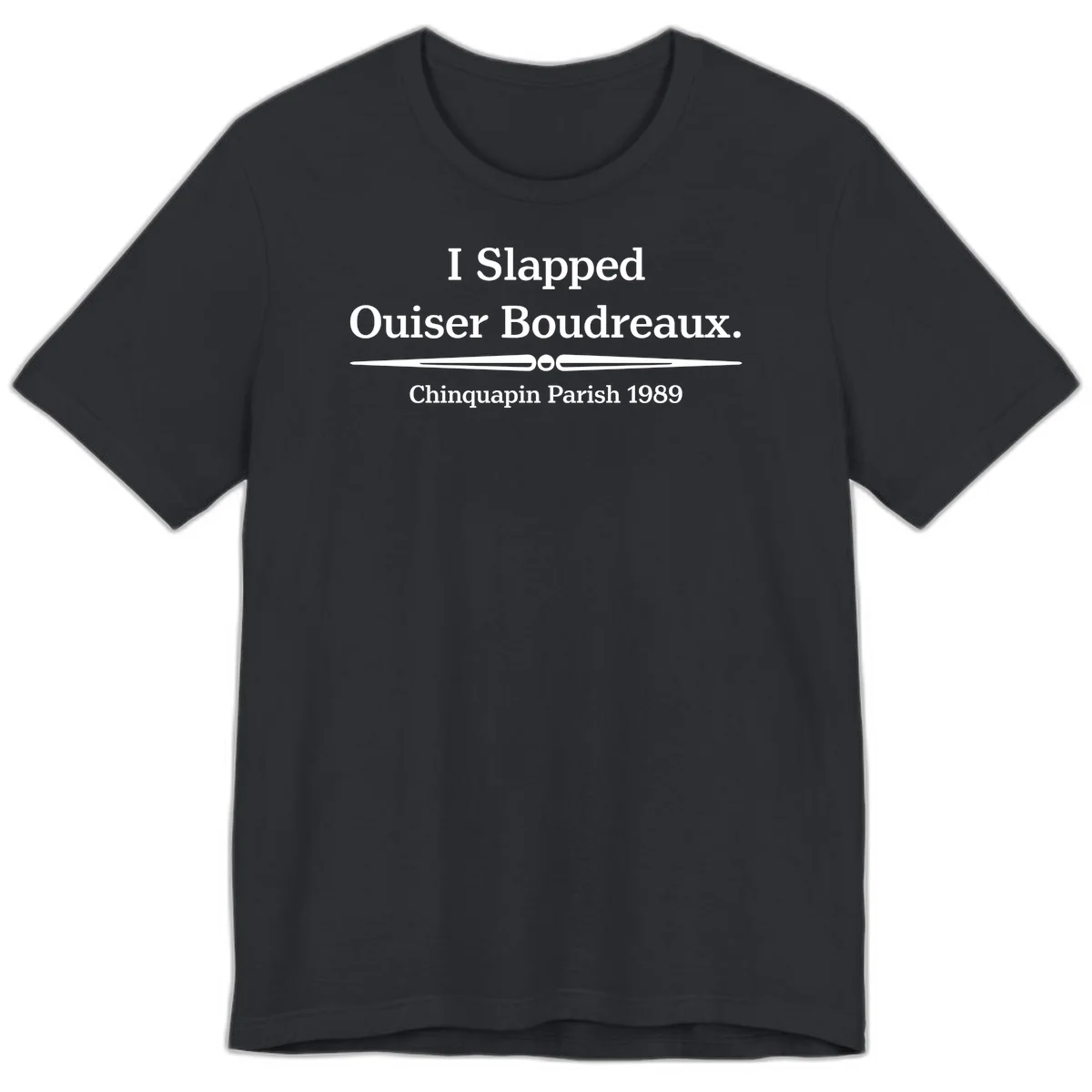 White text on gray background reading 'I Slapped Ouiser Boudreaux. Chinquapin Parish 1989' with decorative line divider in Vintage Black