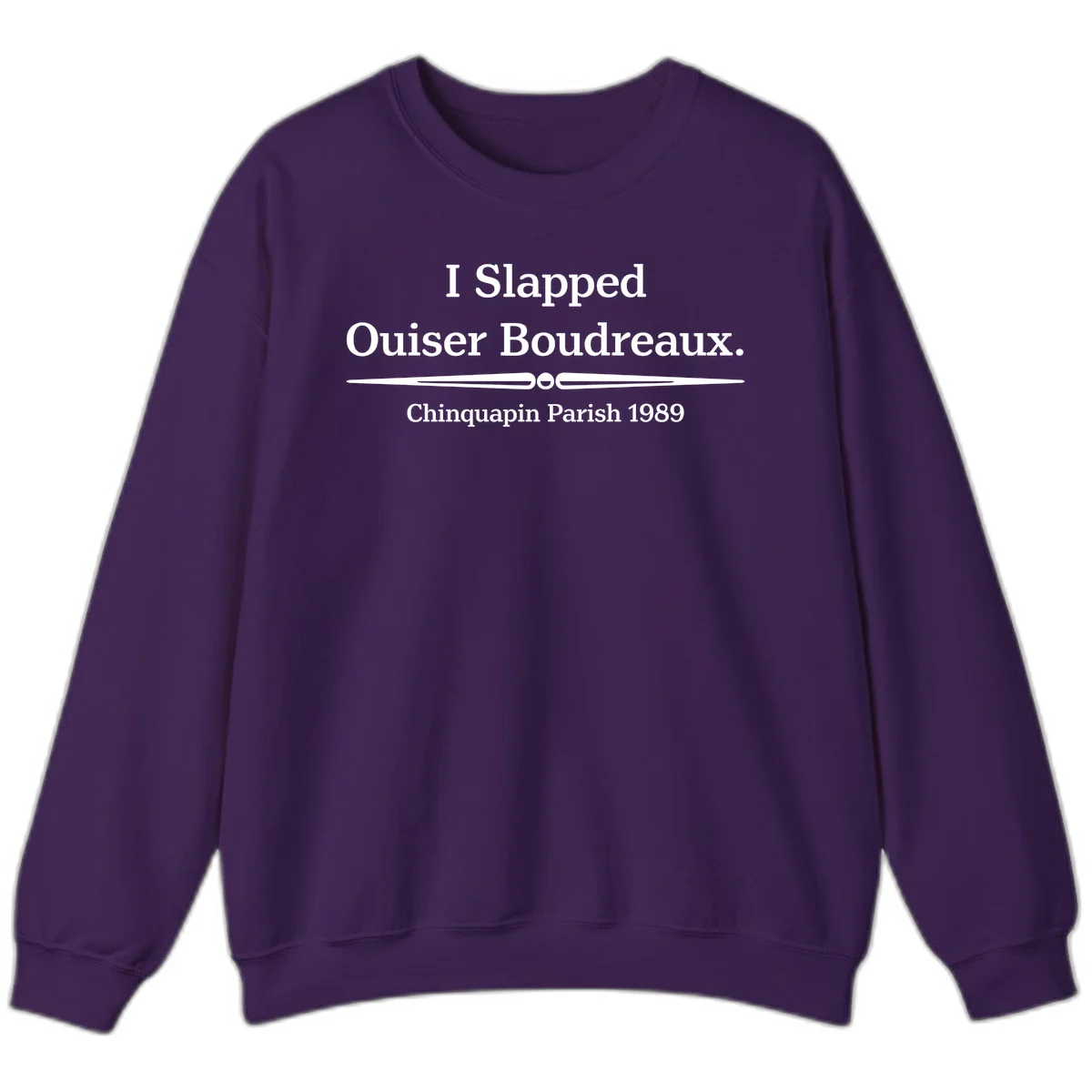 White text on gray background reading 'I Slapped Ouiser Boudreaux. Chinquapin Parish 1989' with decorative line divider in Purple