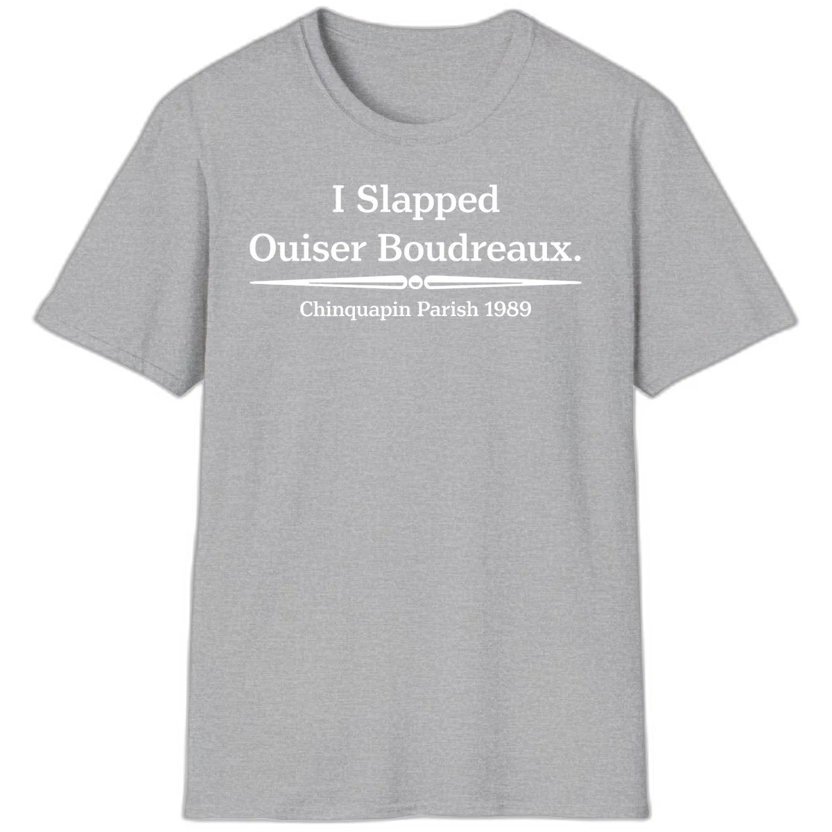White text on gray background reading 'I Slapped Ouiser Boudreaux. Chinquapin Parish 1989' with decorative line divider in Sport Grey